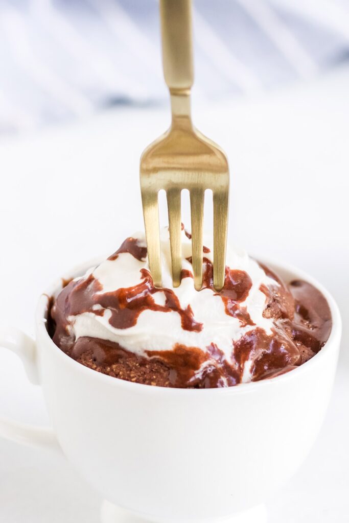 gold fork in a chocolate mug cake