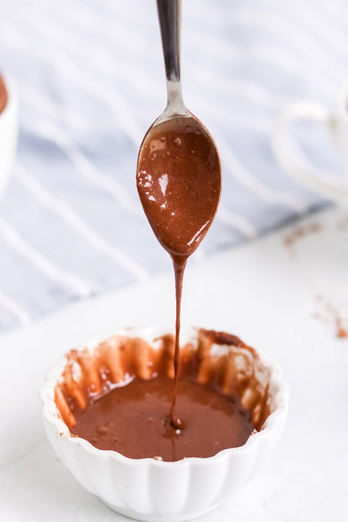 chocolate glaze with a spoon dipped in