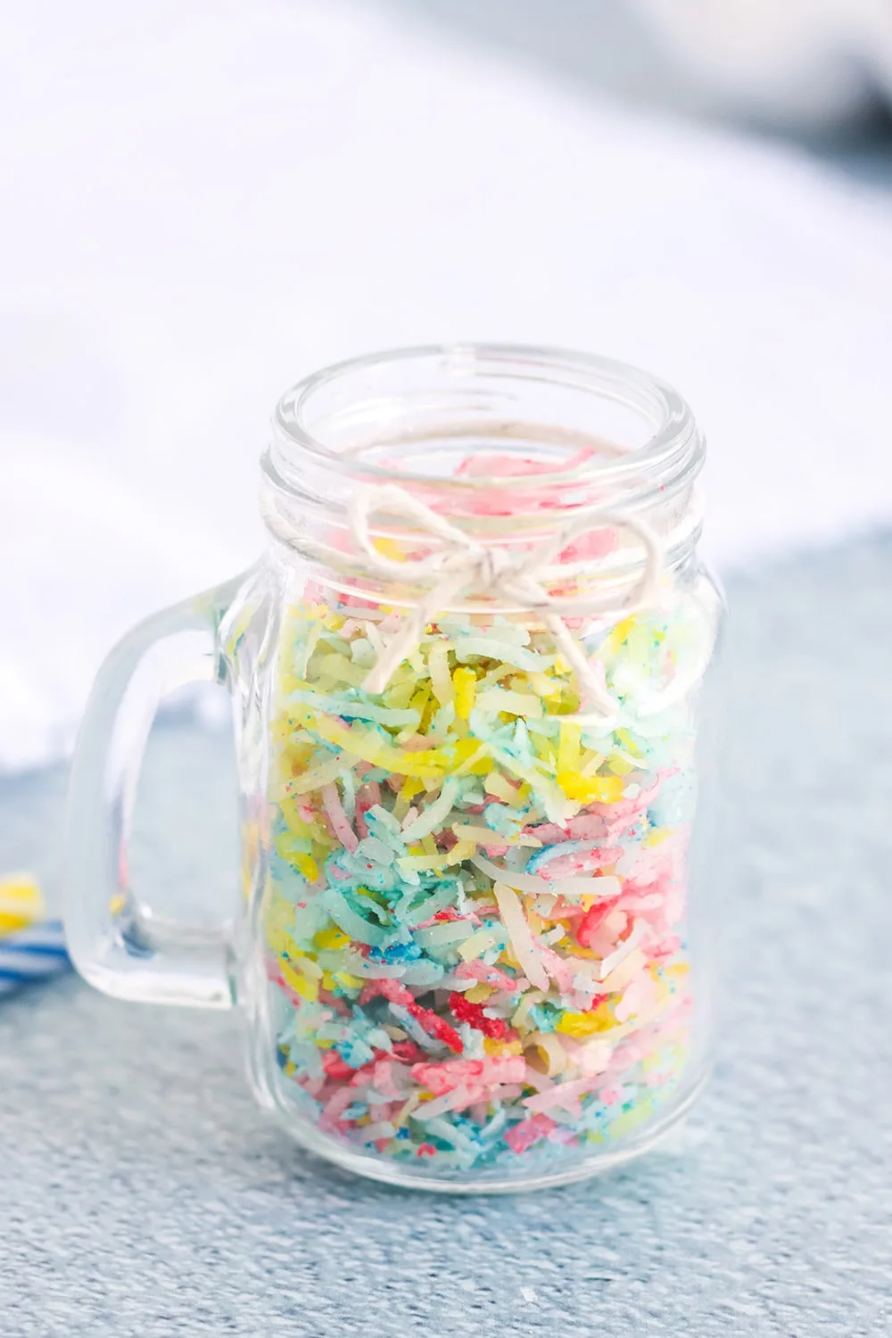 Jar of shredded coconut for confetti sprinkles.