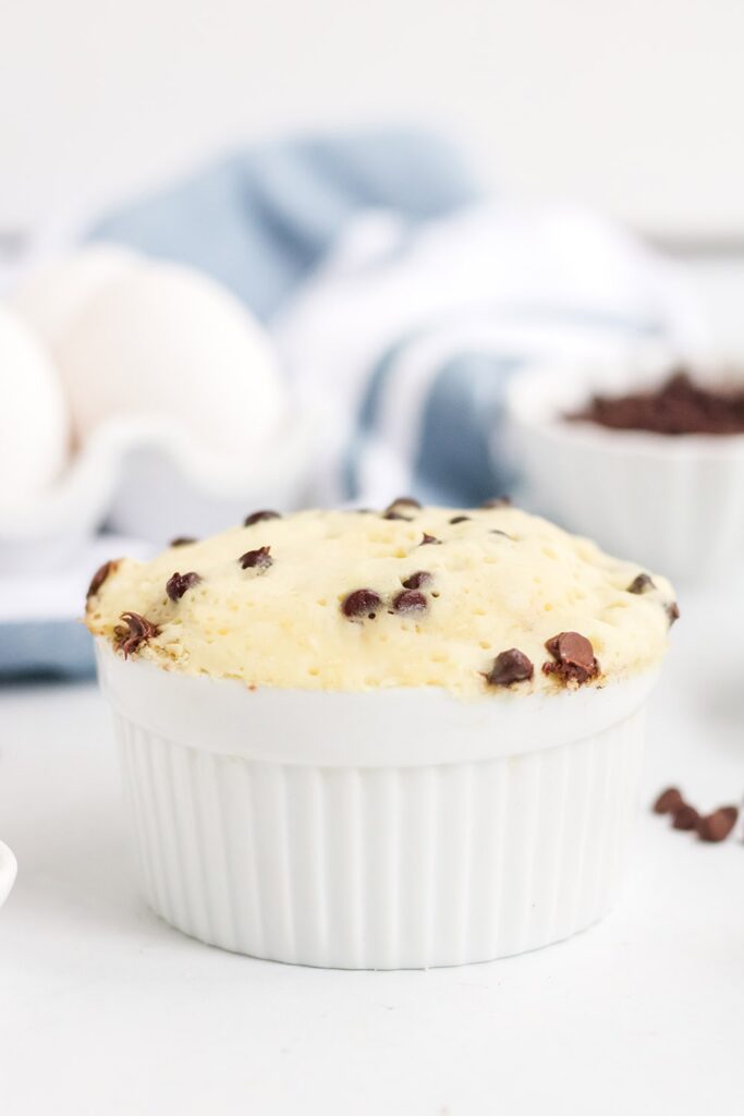 low-carb chocolate chip mug cake after cooked by a blue napkin