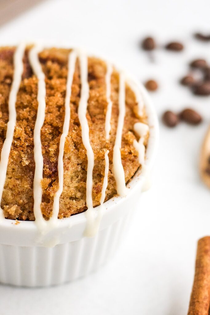 Close up of coffee cake with crumble topping and glaze