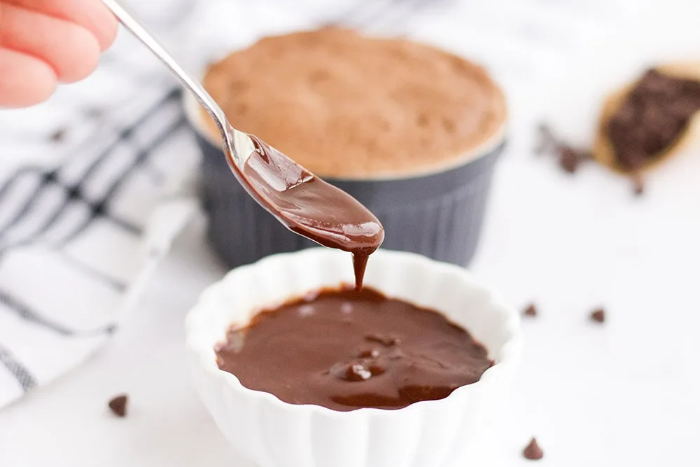 Chocolate glaze for chocolate peanut butter cake in a mug. 