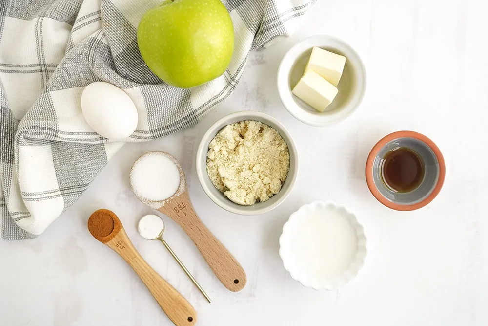 Ingredients in bowls to make an apple mug cake.