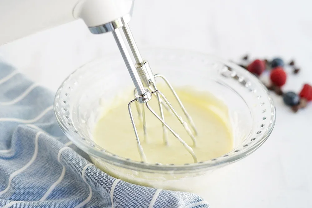 Mixing batter for cheesecake.