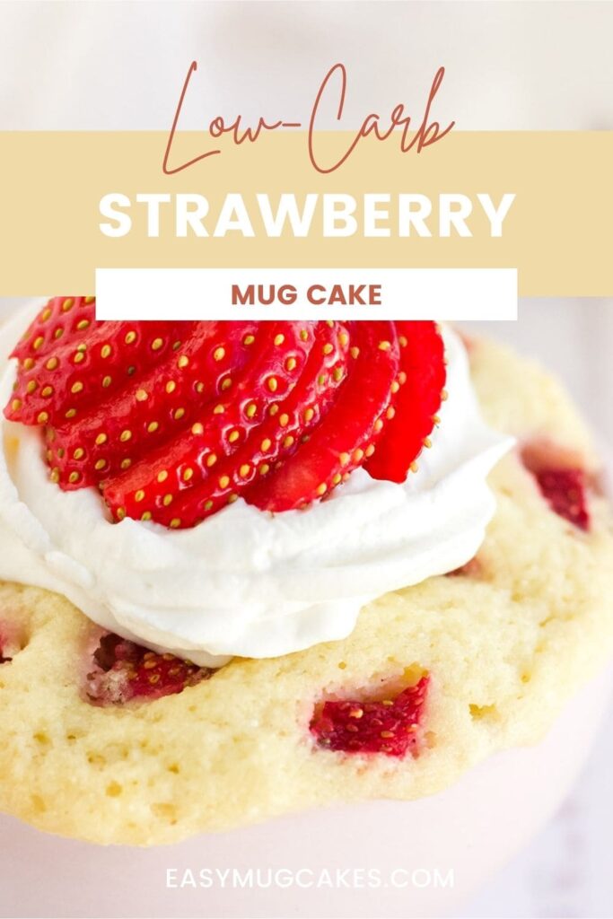 Close up of a strawberry mug cake with whipped cream.